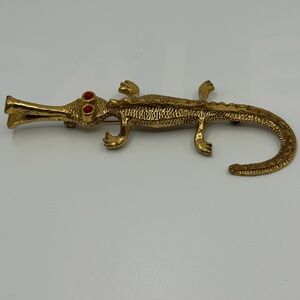 ZENTALL vintage brooch in the shape of a stylized lizard or alligator.